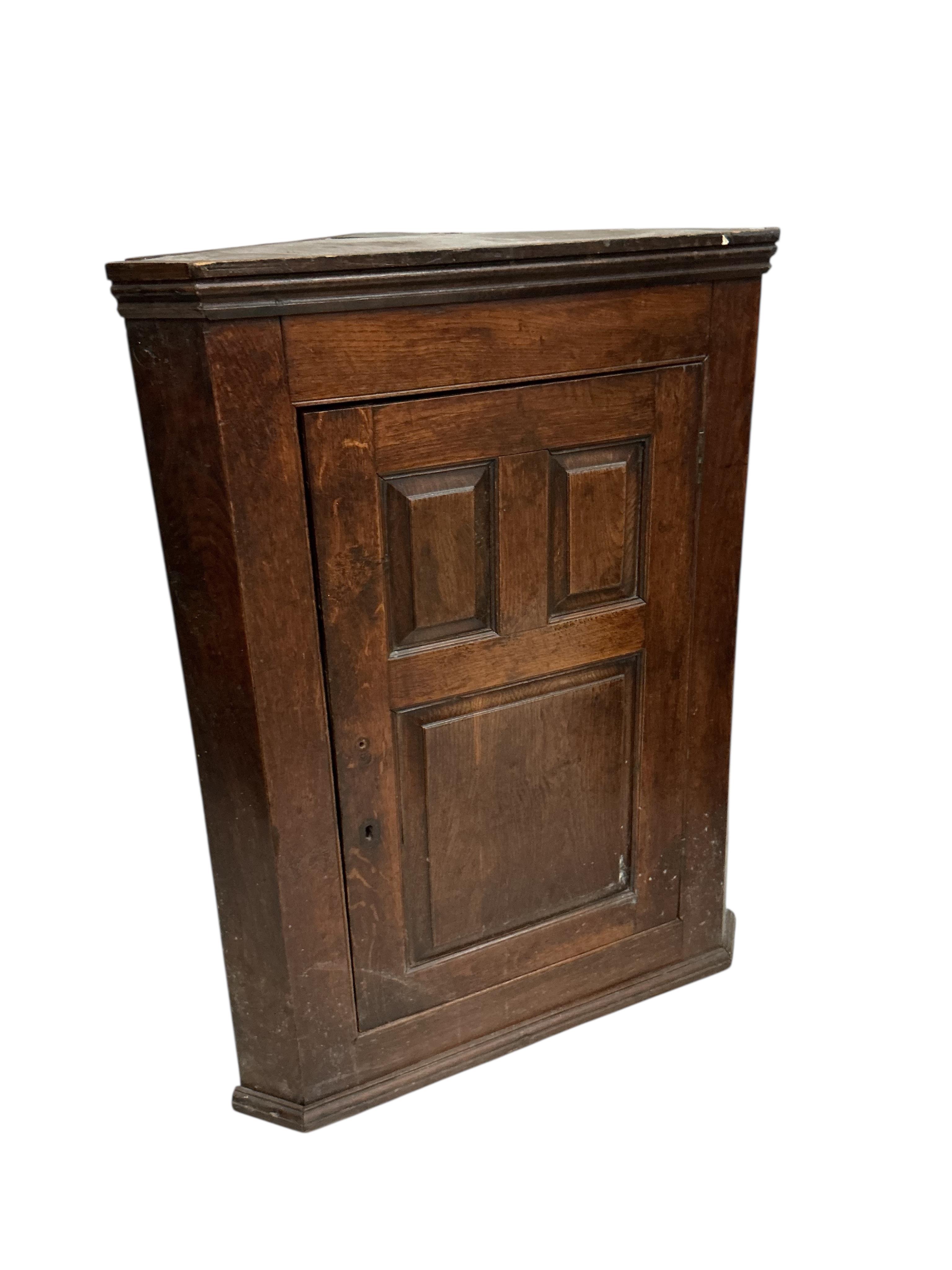 Two George III oak hanging corner cupboards, largest width 102cm, depth 48cm, height 128cm